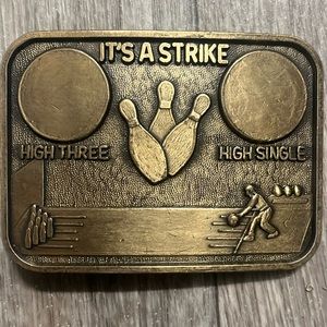 Vintage it’s a strike belt buckle